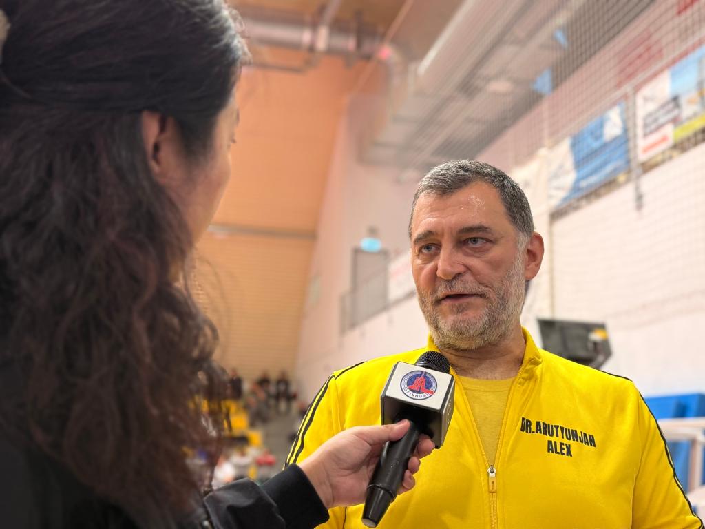 Alex was interviewed by Xinhua News Agency at the 2025 Hungarian Martial Arts Championships. Photo by Xinhua News Agency reporter Chen Hao
